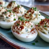 Creamy yolk filling made with mayonnaise and cream cheese makes these deviled eggs look rich and inviting.