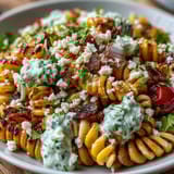Creamy Mexican Street Corn Elote Pasta Salad with smoky spices, fresh cilantro, and juicy cherry tomatoes, perfect for summer gatherings.