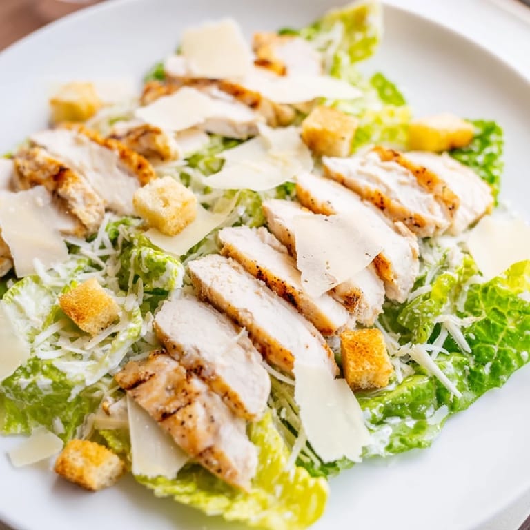 View the final Chicken Caesar Salad: a flavorful, complete main dish bursting with textures.