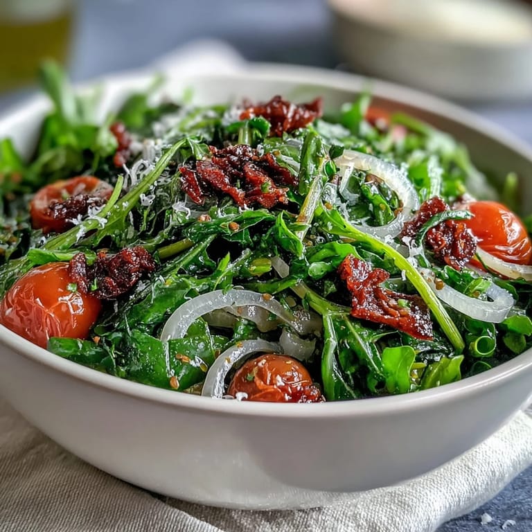 Bright dandelion greens salad featuring lemon vinaigrette, shaved Parmesan, and toasted pine nuts for Mediterranean flair.