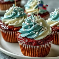 Star-Spangled Banner Cupcakes with festive flag toppers, a patriotic dessert treat.