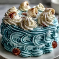 Cancer Zodiac Cake, ocean blue with seashells, a dreamy culinary delight.